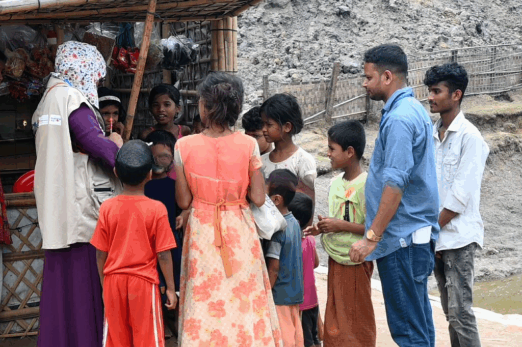 Plan staff member speaks to children in Teknaf, Cox’s Bazar district