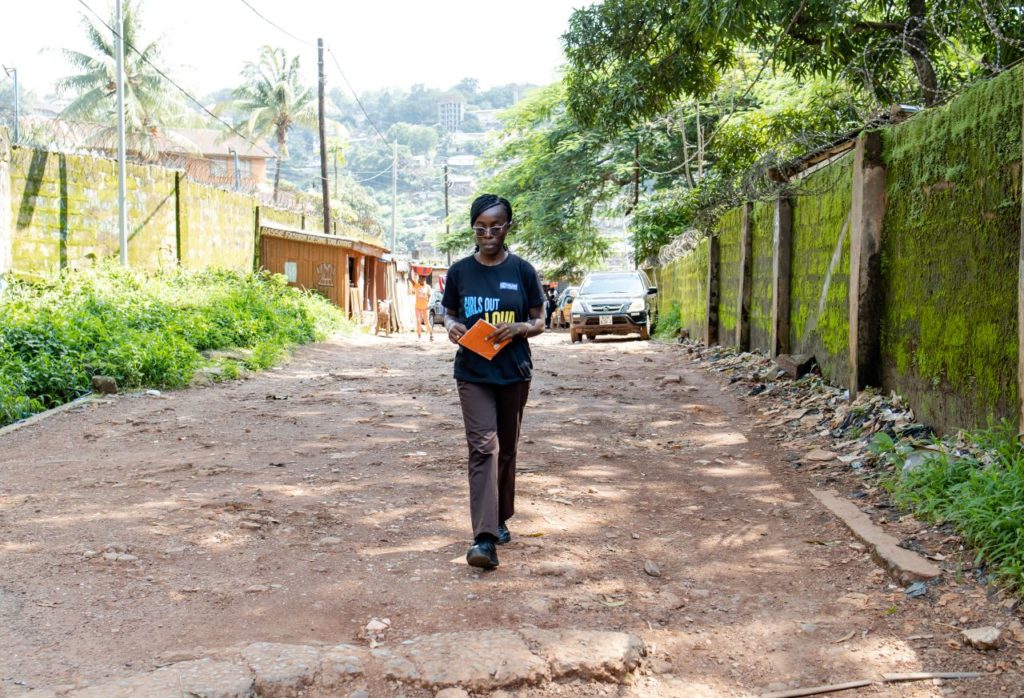 Blessing walking down a street