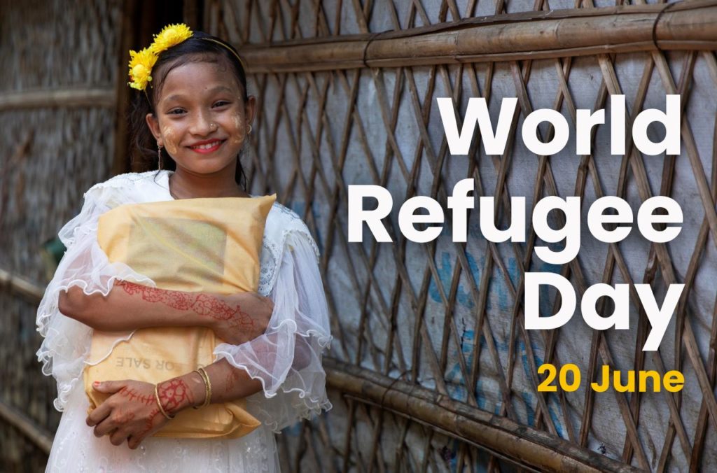 A girl smiling with the words World Refugee Day