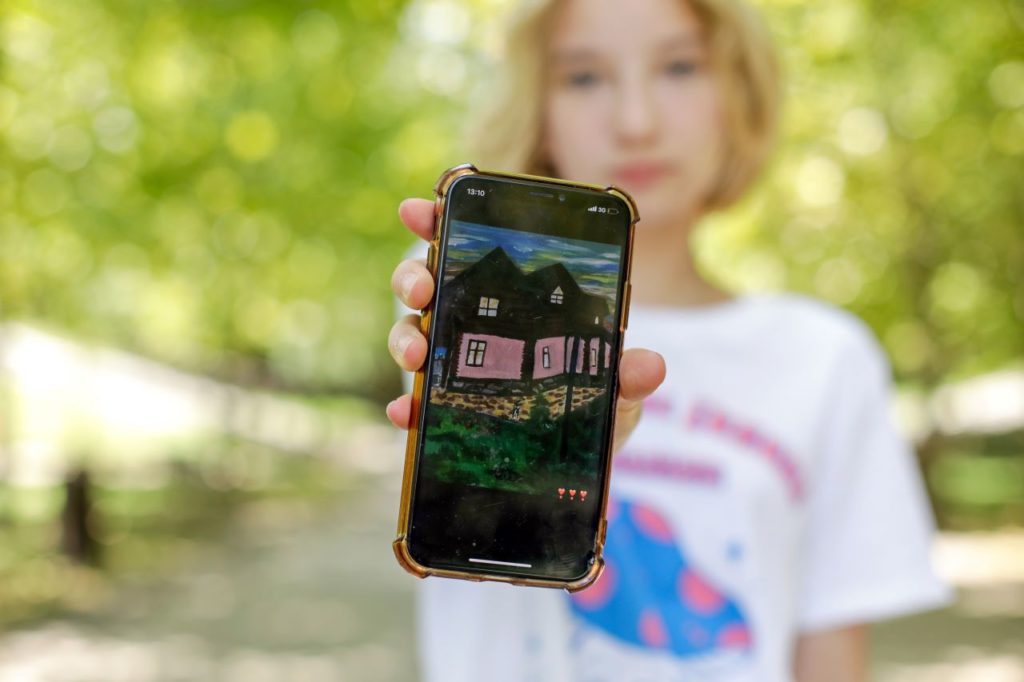 Arina, 13, shares a painting of her home in Ukraine.